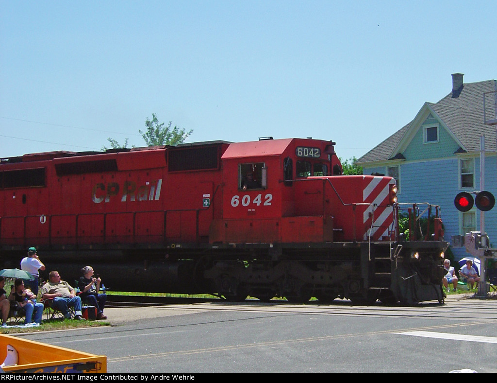 CP 6042 WB interrupts the 4th of July parade